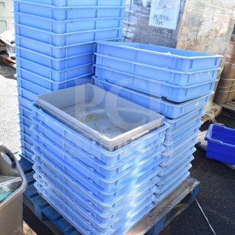 Stack of blue poly dough bins on a pallet, used condition, multiple units included in auction lot.