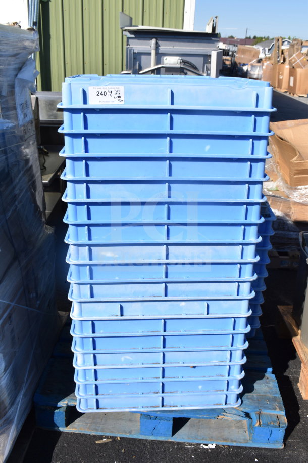 Stack of blue poly dough bins, used, on a pallet. Auction label reads "240", "QTY 40", multiplier "40x."