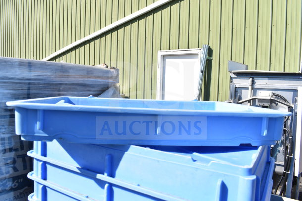 Blue poly dough bins stacked outdoors, part of a lot of 40 various items. Durable plastic construction, good condition.