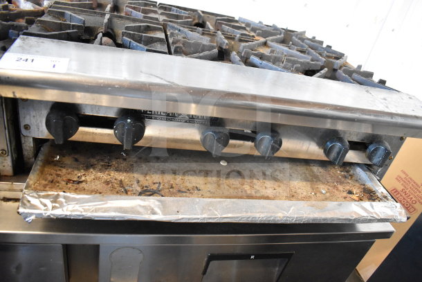 American Range Commercial Countertop Gas 6-Burner Range, used condition, metal knobs, stainless steel finish, visible wear.