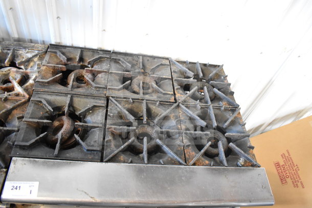 American Range commercial 6-burner gas countertop range, showing moderate wear, with visible rust and auction tag number 241.