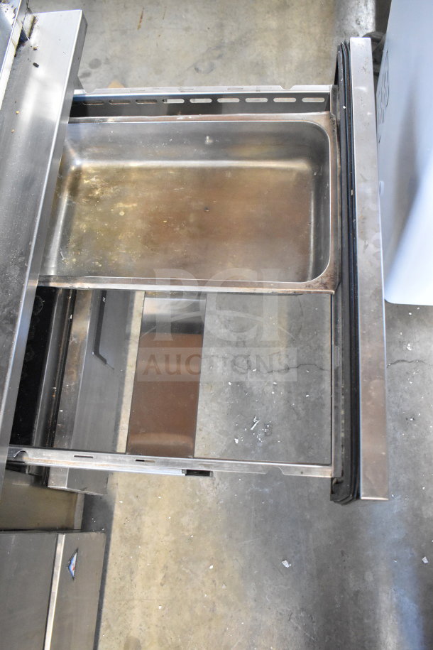 Everest Commercial 4 Drawer Chef Base on casters, stainless steel, showing open drawer. 115 Volts, 1 Phase. Slight wear visible.