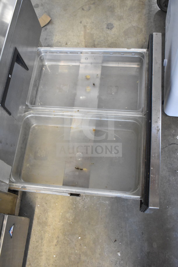 Everest Commercial 4 Drawer Chef Base, stainless steel with clear drawer interiors, on casters, operates on 115 volts.