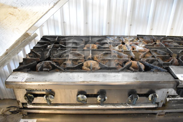 Radiance Commercial 6 Burner Gas Range, countertop model, used condition, visible wear; features robust metal knobs.