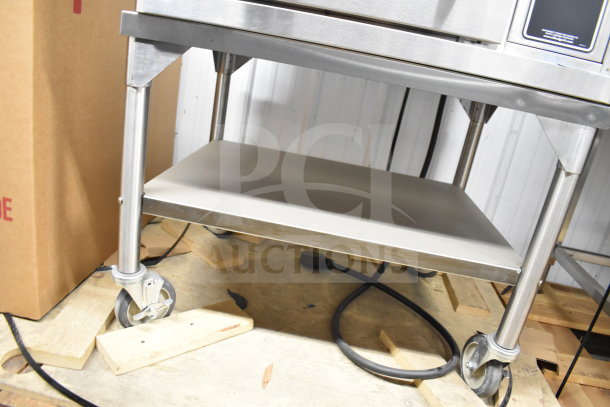 Brand new 2021 Blodgett CTB-1 convection oven on casters, model VLH, 208-240V, showing underside and wheels.