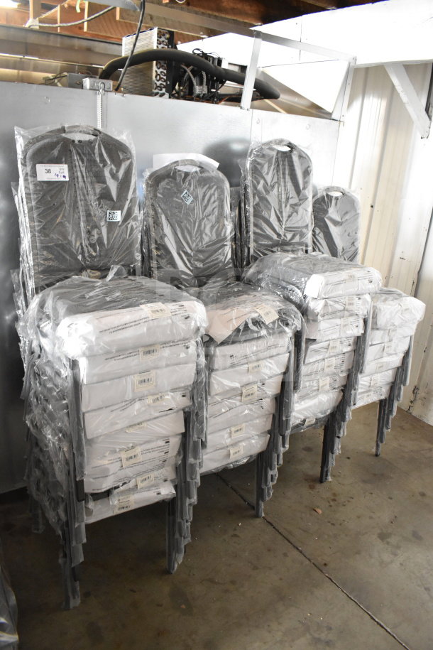 29 new Lancaster stackable banquet chairs with gray fabric, silver vein frames, in original wrapping, minor flaws.