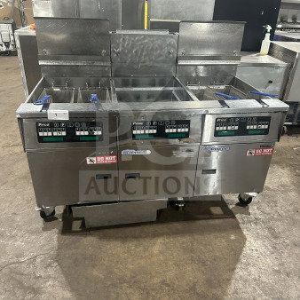 Pitco Solstice SSH75 stainless steel triple bay deep fryer on casters, with backsplash and baskets, 115V, natural gas powered.