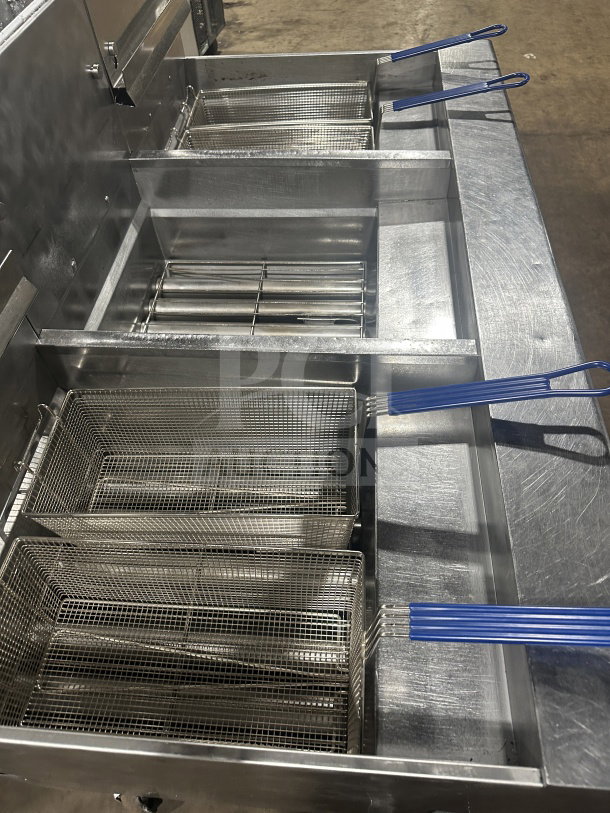 Pitco Solstice Supreme SSH75 triple bay deep fat fryer with backsplash, basket fryer, on casters. Stainless steel, natural gas.
