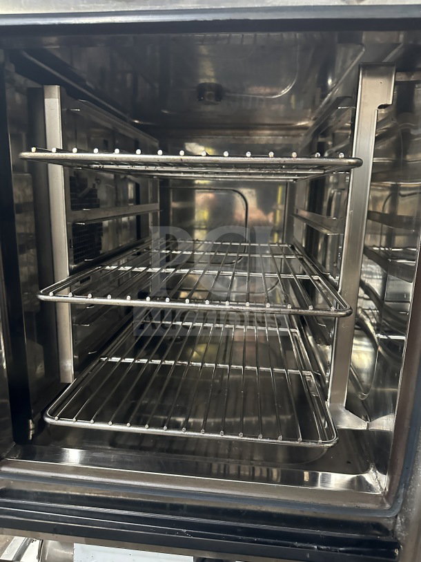 Angelo Po FX61G3UKX02 combi oven, stainless steel interior, features programmable digital touch display and wired racks.