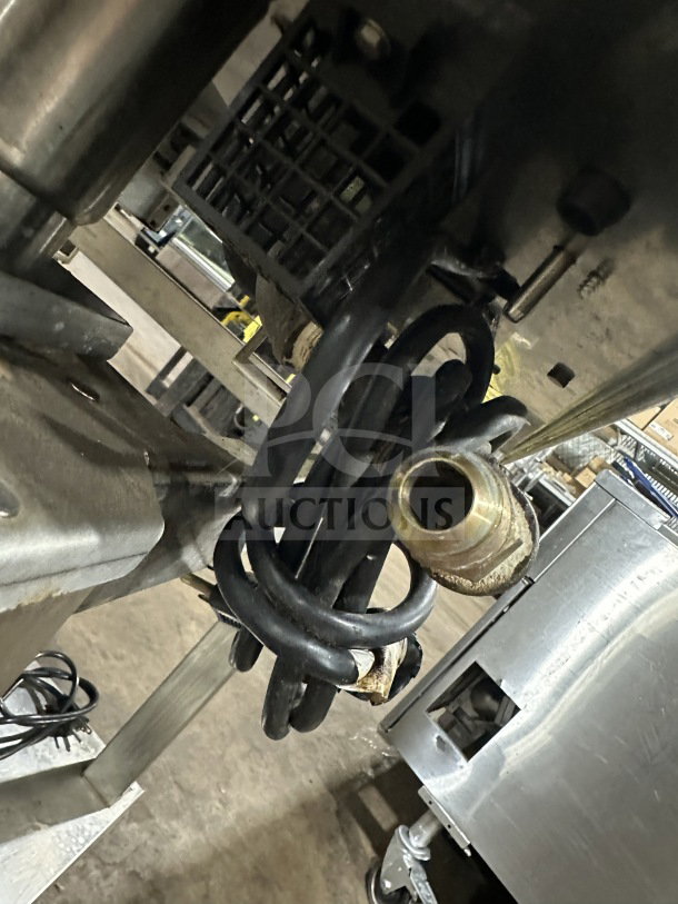Angelo Po FX61G3-UKX02 stainless steel combi oven underside, showing wired connections and part of the equipment stand.