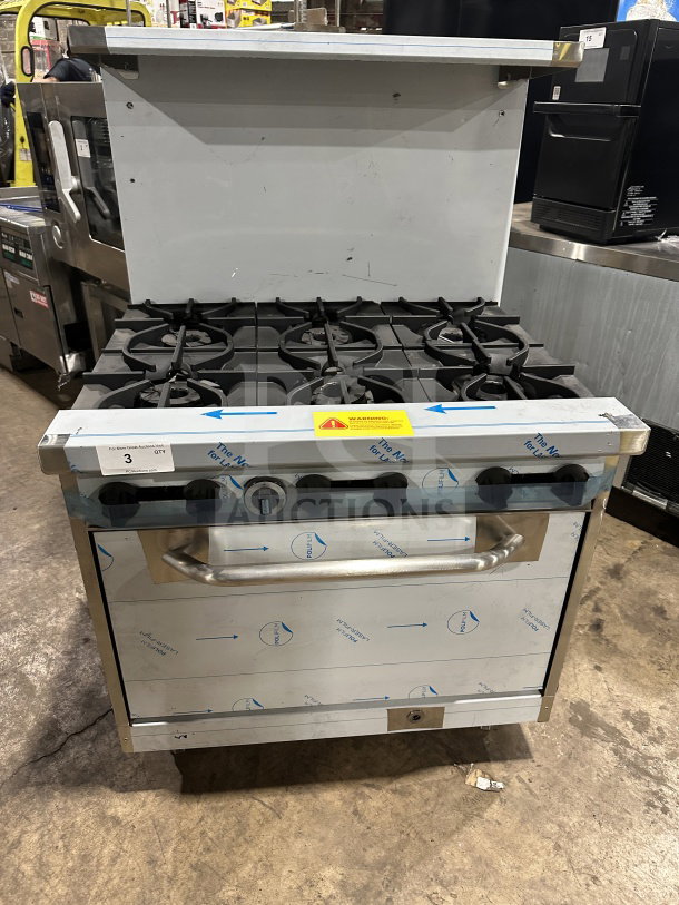 Brand new Kutano 36" 6-burner stainless steel range/oven, natural gas, model KUT6BRN36N6, with wired oven rack, on legs.