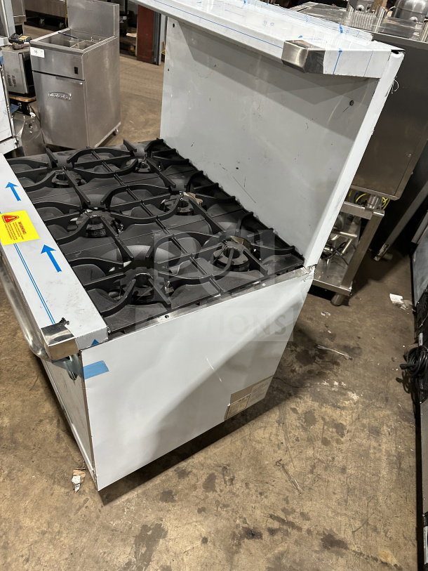 Brand new Kutano 36" 6-burner gas range/oven combo, model KUT-6-BR-N-36-N6, with wired oven rack. Scratch & dent condition.