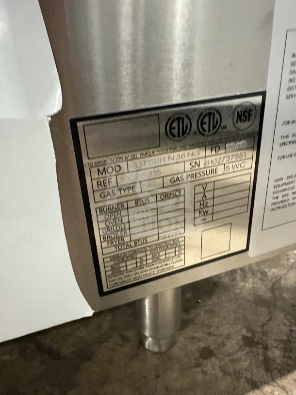 Kutano Commercial 36" 6-burner range, model KUT-6-BR-N-36-N6. Stainless steel, new condition. Visible tags show serial number 8102737551.