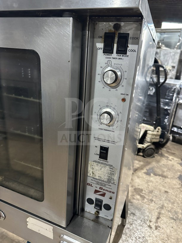 Southbend stainless steel single-stack gas convection oven, thermostatic controls, wired rack, Energy Star certified, on legs.