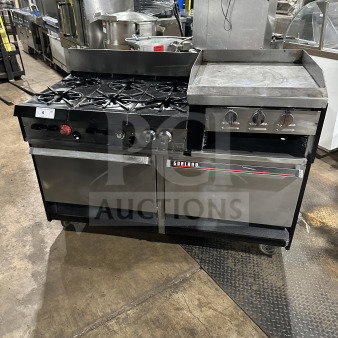 Garland commercial stainless steel gas range with 6 burners, raised griddle, double oven, broiler, backsplash, and casters.