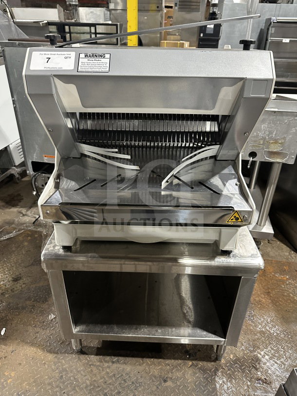 JAC Pico MJL 450/13 electric bread slicer, heavy-duty, countertop model, silver finish, on legs, warning label visible, used condition.