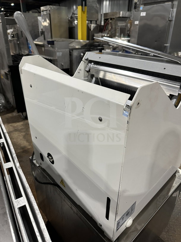 JAC Pico Series MJL45013 electric bread slicer, 120V, commercial grade, automatic feed, on legs, in good condition.