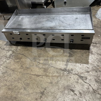 Garland Commercial Stainless Steel Countertop Gas Griddle, Model 60.5, on legs, good condition, three burner knobs.