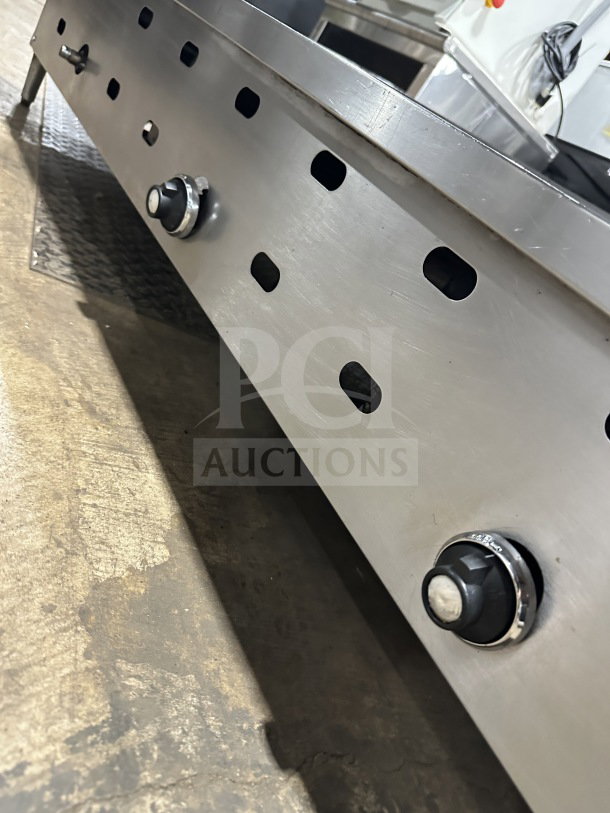 Garland 60.5 Commercial Stainless Steel Gas Griddle with control knobs, on legs; durable countertop design.