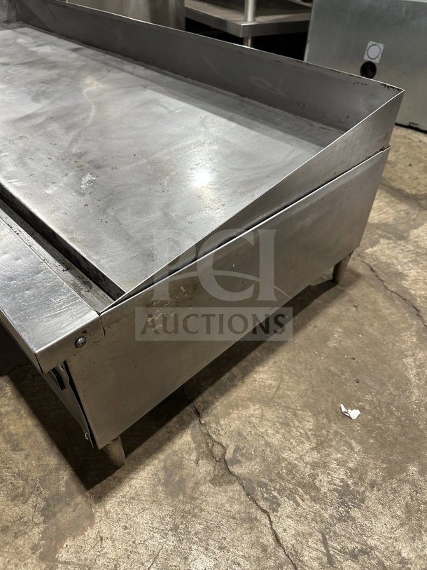 Garland Model 60.5 stainless steel countertop gas griddle on legs; used, sturdy, ideal for commercial kitchens.