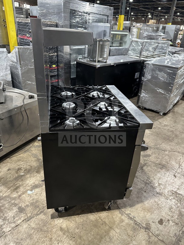 Vulcan 36L commercial range/oven with French top, 6 burners, backsplash, salamander shelf, on casters, stainless steel.
