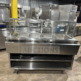Randell stainless steel 4-well electric steam table, Model RANHTD4S. Features sneeze guard, 2-shelf storage, casters, 120V.