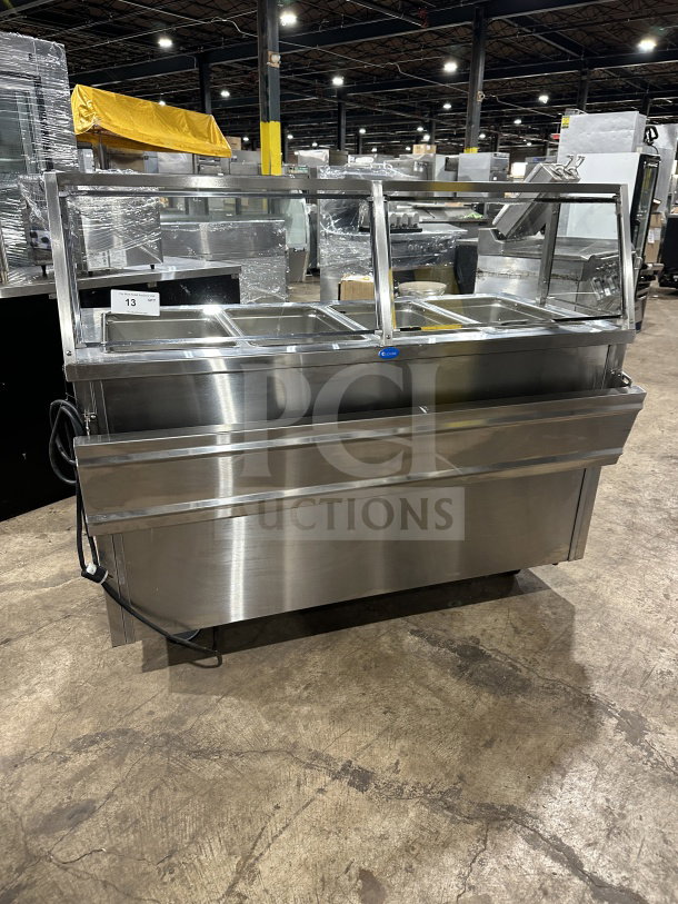 Randell RANHTD4S stainless steel 4-well steam table with sneeze guard, 2-shelf storage, on casters, 120V, excellent condition.