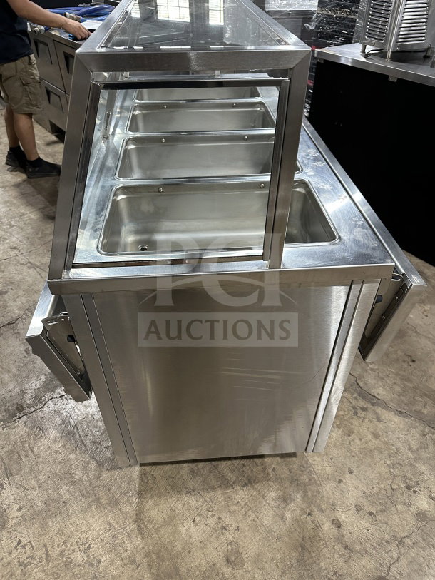 Randell RANHTD4S stainless steel 4-well steam table with sneeze guard, 2-shelf storage, on casters, 120V, 1-phase.