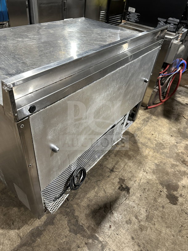 True commercial stainless steel 4-drawer worktop refrigerator, model TWT-48D-4, Energy Star certified, on casters.