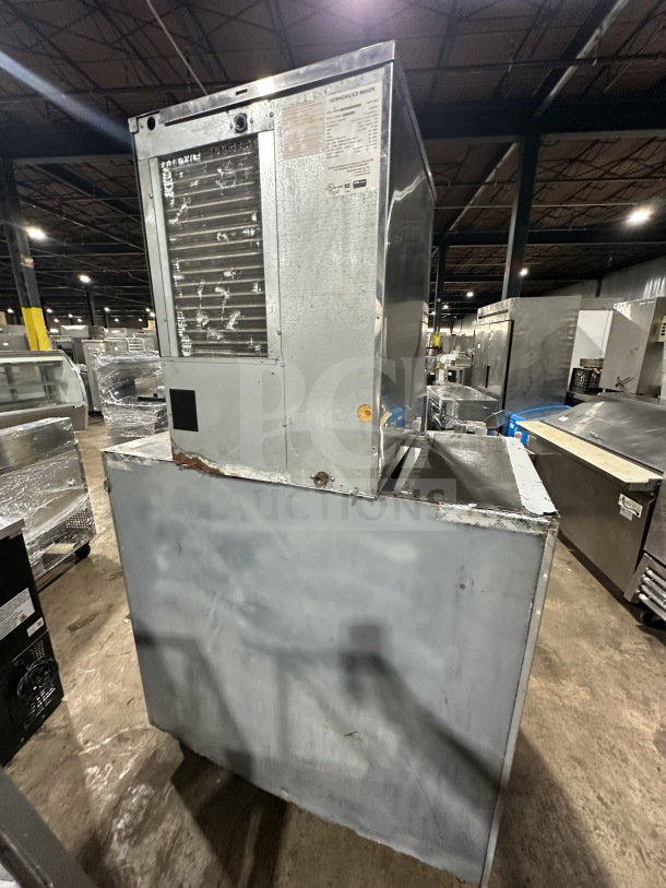 Hoshizaki KM515MAH commercial ice machine, stainless steel, air-cooled, electric, on legs, model KM-515MAH, SN B04669A.