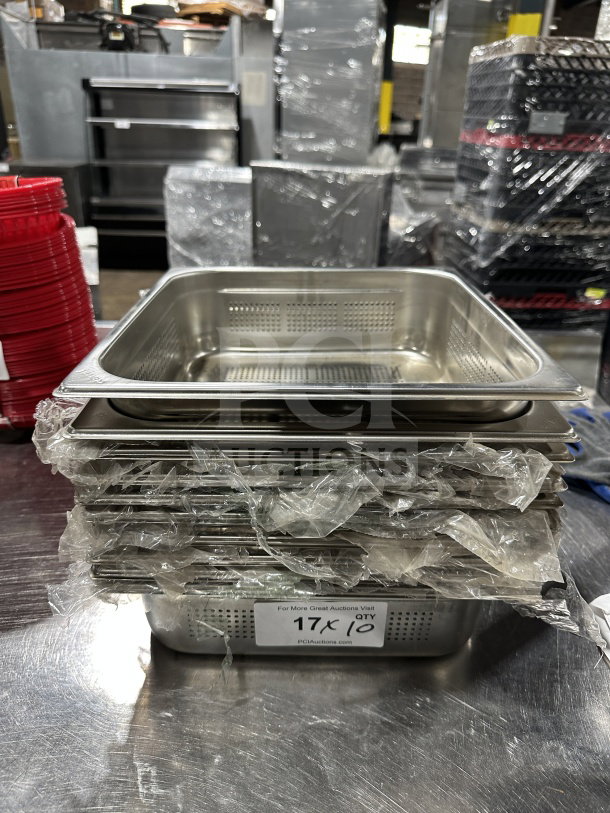 New commercial stainless steel perforated full-size steam table pan, stack of five, wrapped, label reads "17X10".