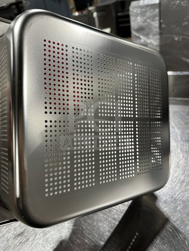 New commercial stainless steel perforated full-size steam table pan, pristine condition, durable construction.