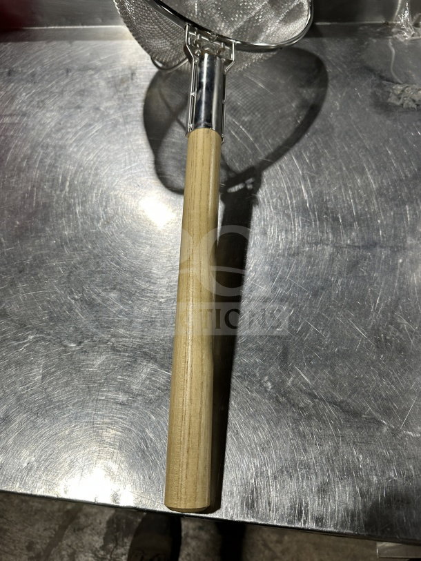 Brand new 12" double mesh stainless steel bowl strainer with wooden handle. Ideal for commercial use.
