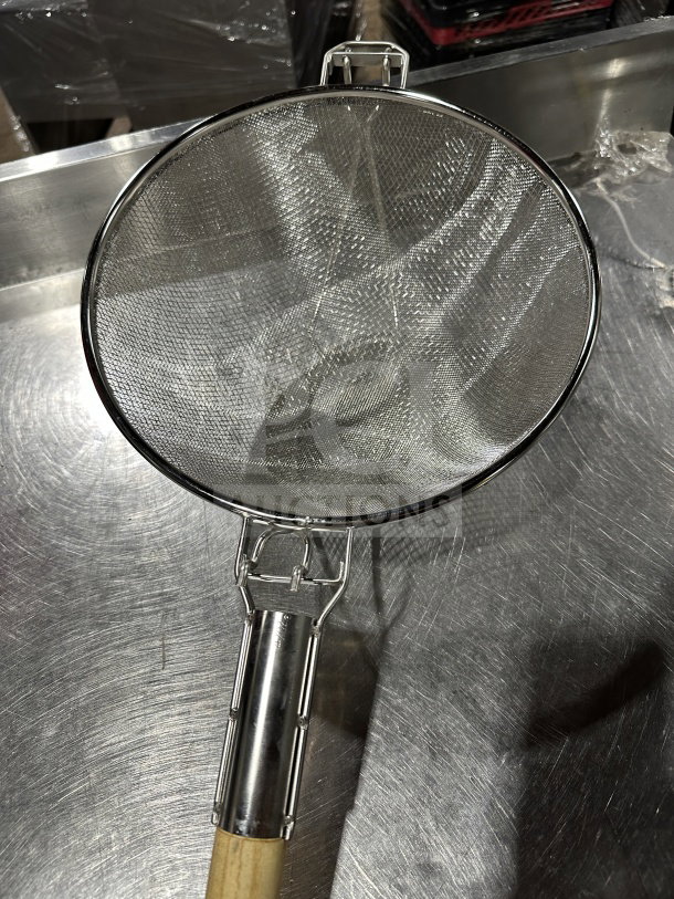Brand new 12" double mesh stainless steel bowl strainer with wooden handle, ideal for commercial use.