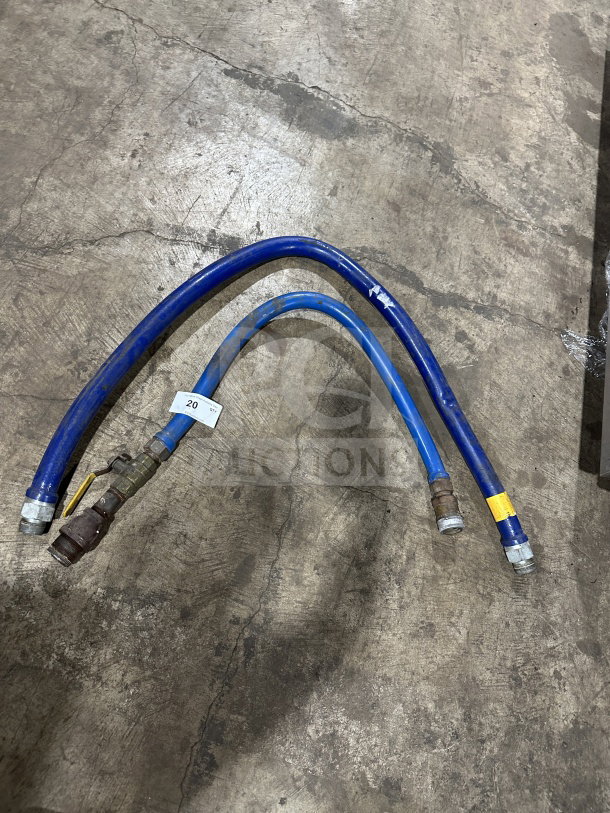 Dormont blue commercial moveable gas connector hoses in used condition, featuring yellow and white labels.