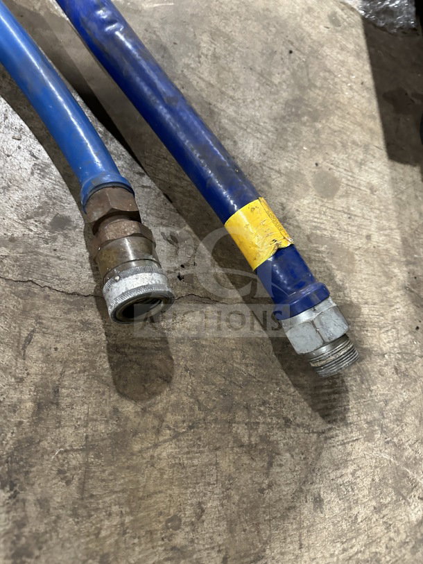 Dormont blue commercial gas connector hoses, moveable, used condition, featuring metal connectors and yellow label marking.
