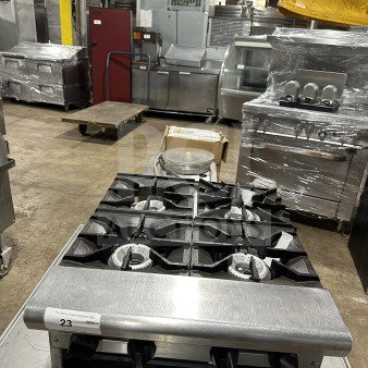 American Range stainless steel 4-burner gas hot plate, thermostatic controls, excellent condition, auction tag 23 visible.