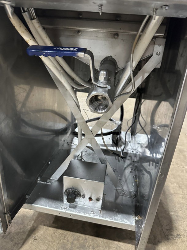 Imperial commercial stainless steel electric deep fat fryer, features backsplash, basket hanger, and fryer basket. Mounted on casters.