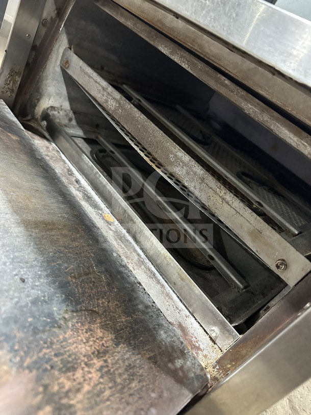 Bakers Pride P18 stainless steel electric pizza oven, single chamber double deck, showing used interior, 208/240V, 1 phase.