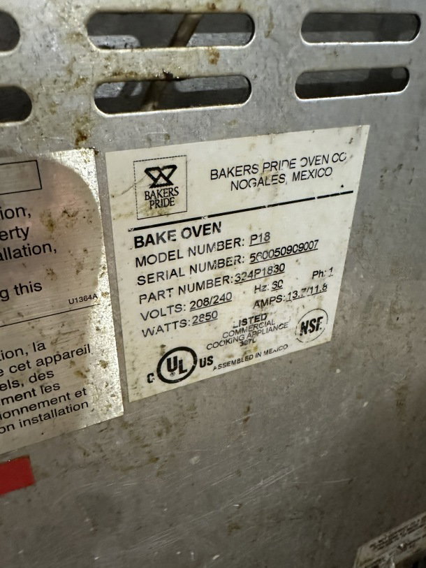 Bakers Pride P18 stainless steel electric pizza oven label, showing model, serial number, voltage, and certifications.