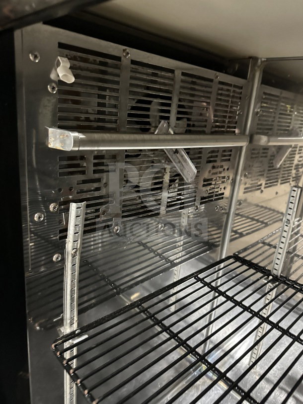 Perlick BBS60RM stainless steel 2-door bar back cooler with chrome wire rack. On casters, 115V. Model SN: 713287.