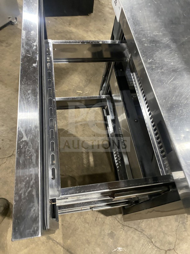 Turbo Air TST-28SD-D2-N stainless steel refrigerated prep table, 2 drawers, on casters, 115V, model visible.