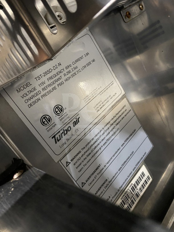 Turbo Air TST-28SD-D2-N 2-Drawer Prep Table, Stainless Steel, 115V, Model Label, Serial H2S282DE7008, on Casters.