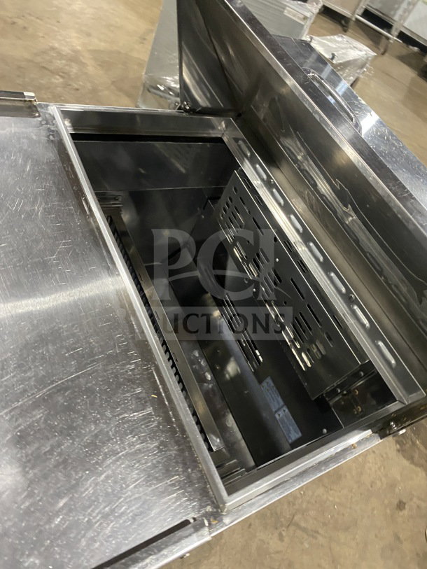 Turbo Air stainless steel 2-drawer refrigerated prep table, Model TST-28SD-D2-N, in good condition on casters.