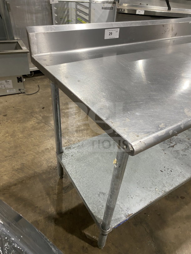 L&J commercial stainless steel worktop table with undershelf and legs. Minor scratches present. Tag reads "29 CT."