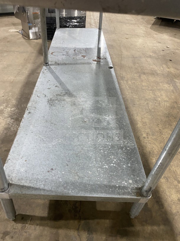 L&J commercial stainless steel worktop table with undershelf, on legs. Good condition, durable design, ideal for kitchens.