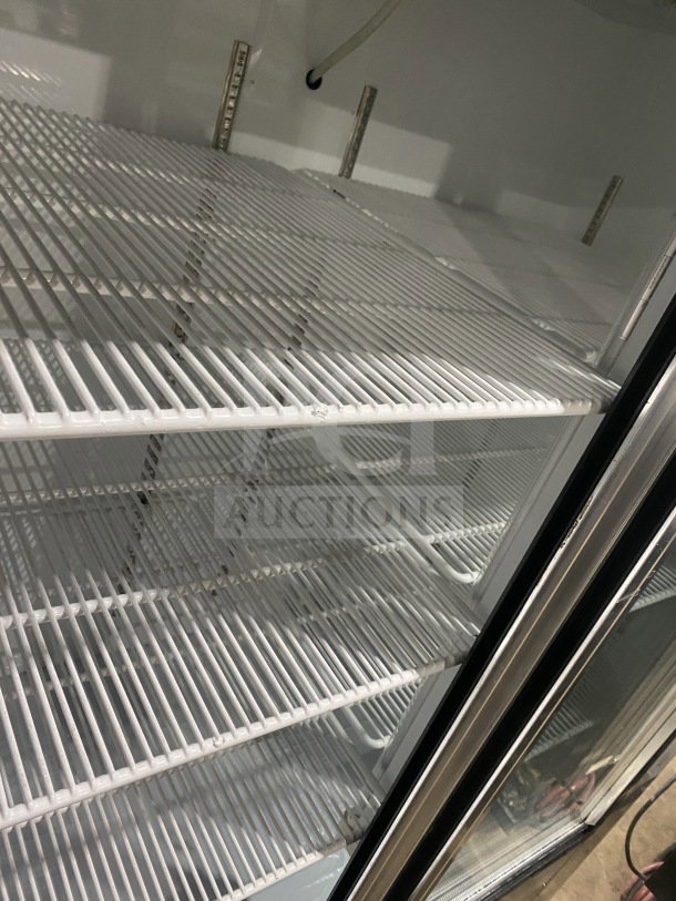 Leader Model LS54SC commercial refrigerator with sliding glass doors and poly-coated racks. Serial: UR061751. 115V, 1 phase.