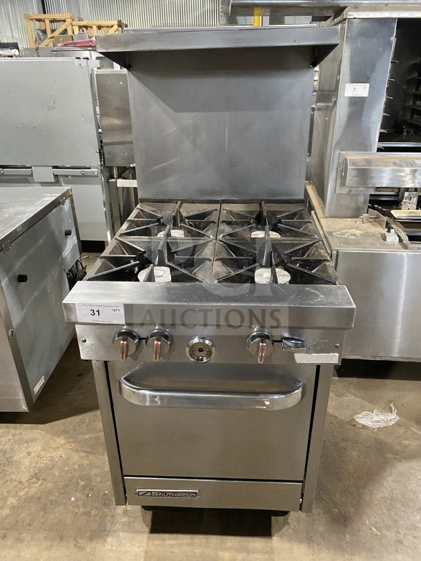 Southbend S241E commercial stainless steel 4-burner gas range/oven with backsplash, salamander shelf, and casters.