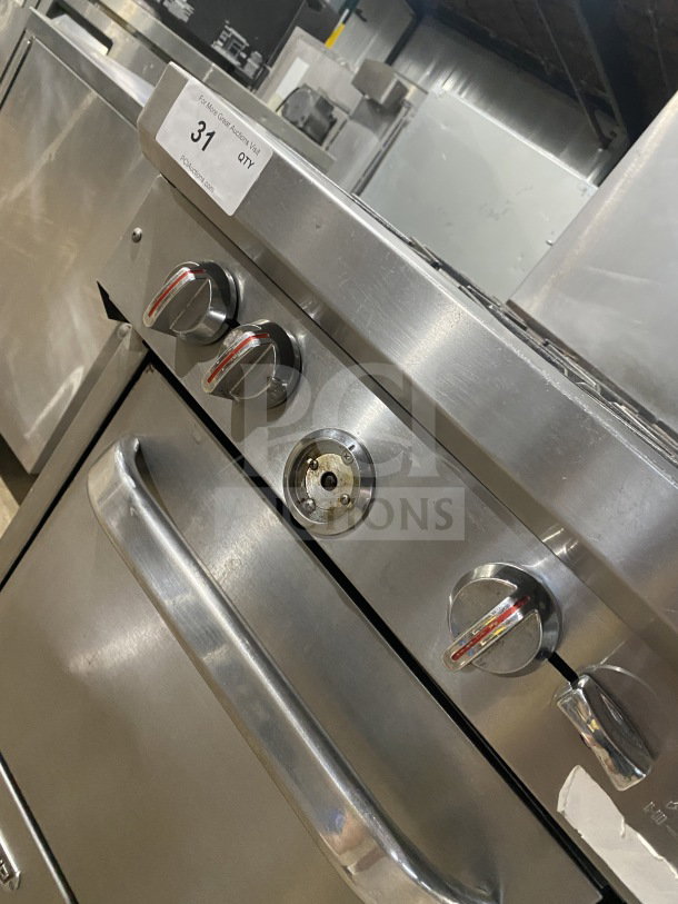 Southbend S241E 4-burner range/oven combo, stainless steel, natural gas, with backsplash, overhead salamander shelf, on casters.