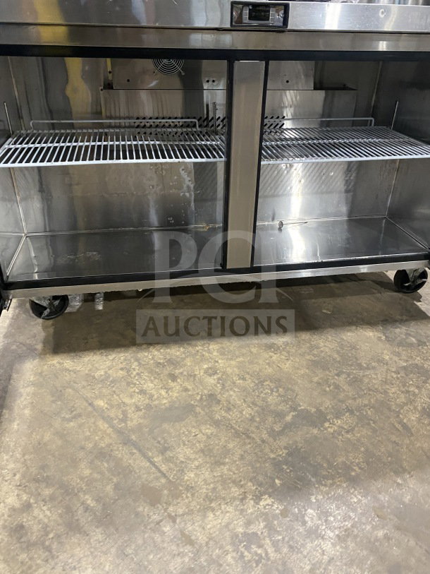 Migali Commercial 2-Door Undercounter Refrigerator, model CU60RHC, stainless steel, poly-coated racks, on casters, good condition.